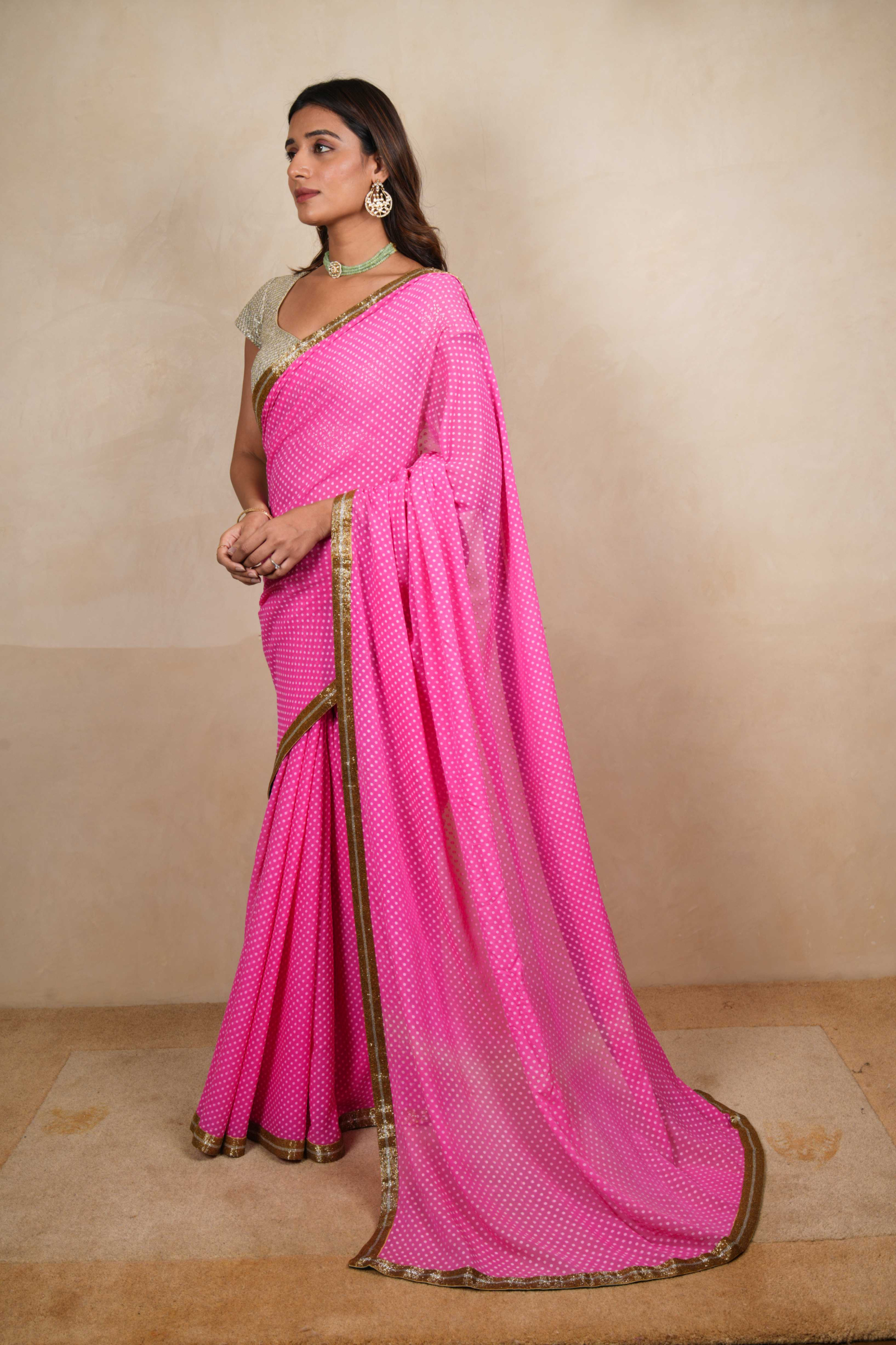 Light pink chiffon saree with a silver blouse